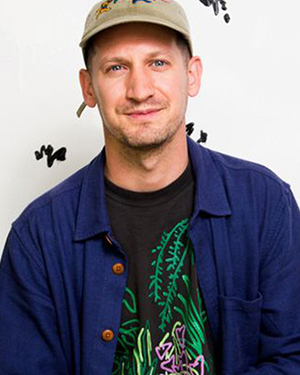 A man wearing a hat and a shirt.