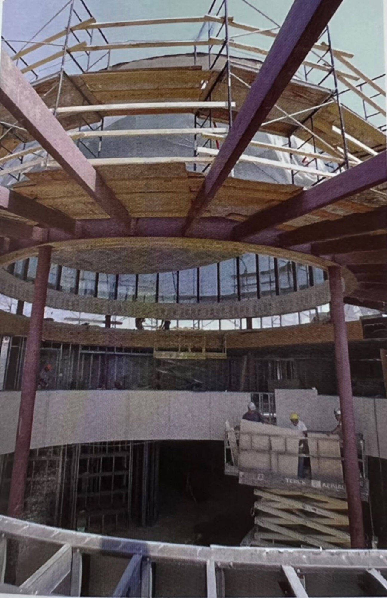 A building under construction with a circular roof.
