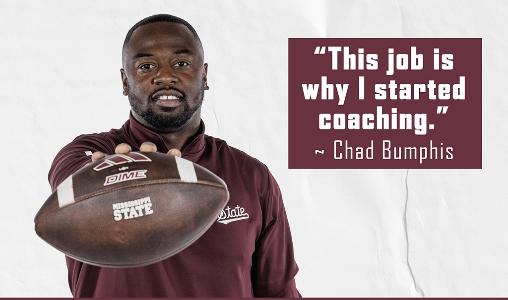 A man holding a football, wearing a maroon jacket with 'State' on it, is next to a quote: "This job is why I started coaching." - Chad Bumphis.