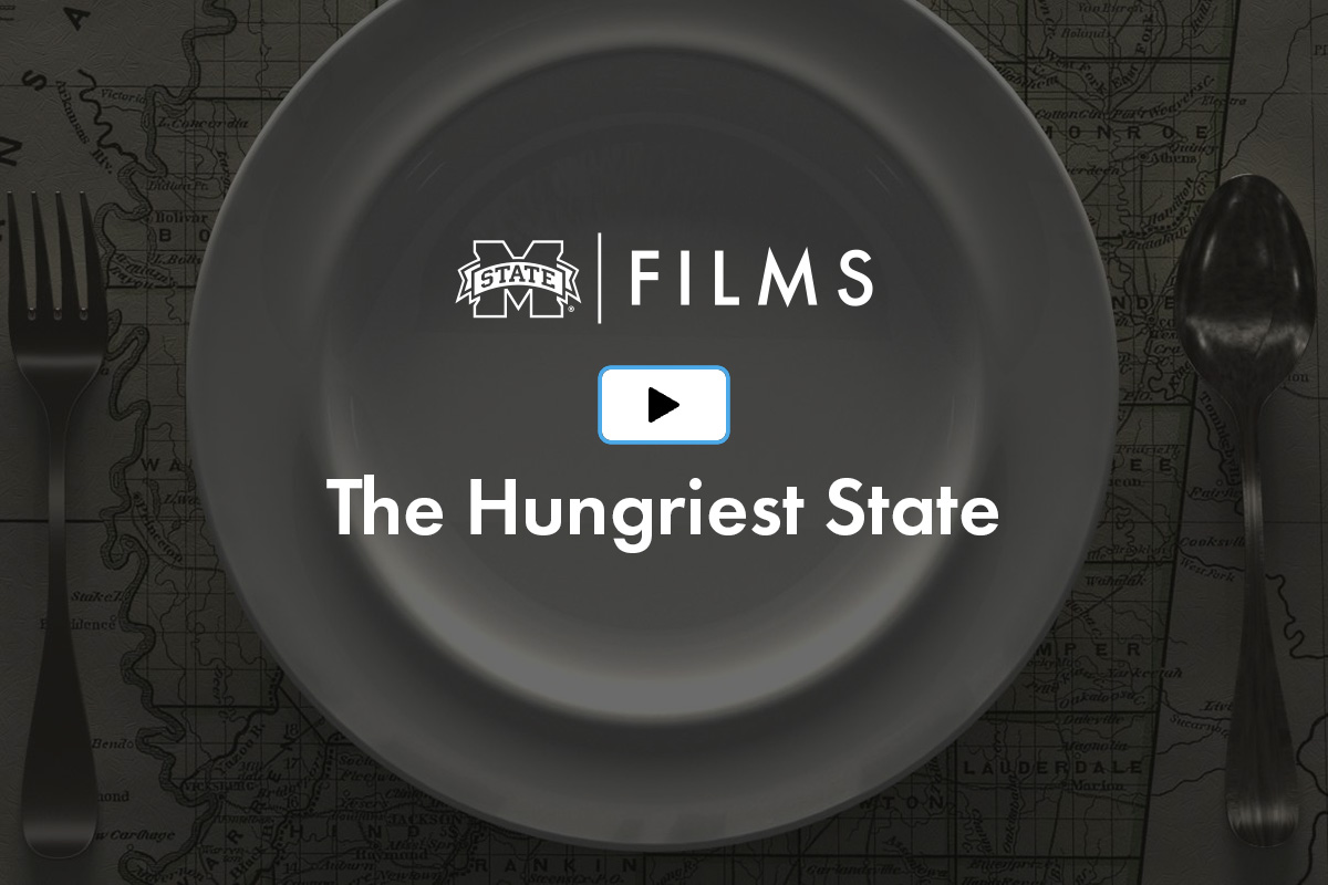 A plate with "FILMS" and "The Hungriest State" text on it, placed on a map background with a fork and spoon on the sides.