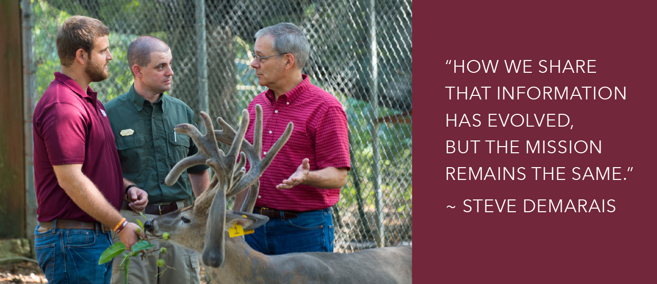 Three men stand outdoors near a deer with large antlers, talking. Quote on right reads: "How we share that information has evolved, but the mission remains the same." ~ Steve Demarais.